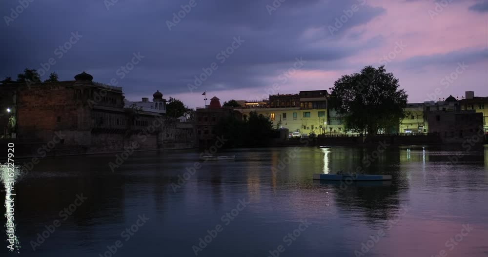 Famous tourist landmark blue city Jodhpur at night: view of lake and Mehrangarh Fort. Rajasthan, India. Horizontal camera panning Famous tourist landmark blue city Jodhpur at night: view of lake and Mehrangarh Fort. Rajasthan, India. Horizontal camera panning