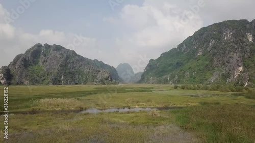 Beautiful mountains in Ninh Binh in Vietnam during a sunset by drone
