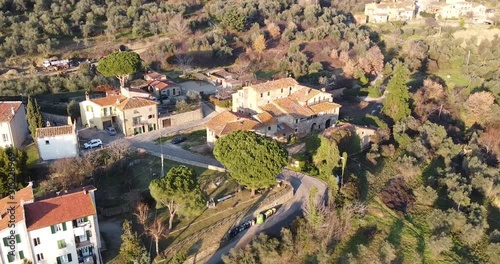 Aerial of Casabiondo farmouse villa surroundings in Tuscany which was famous in the last century as one of the premium quality wood oven in the Florence surrounding hills. Winter season at sunset photo