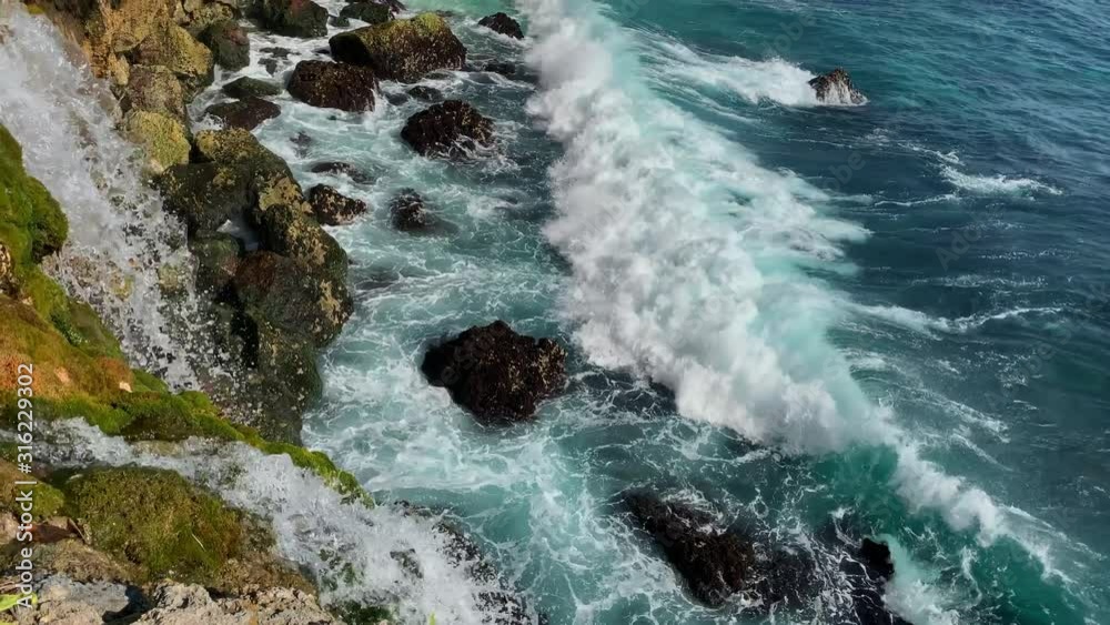 Wave breaking rocky the seashore Wave breaking rocky the seashore