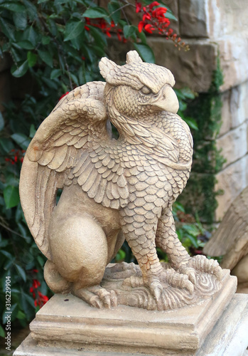 Griffin, gryphin, griffon or gryphon statue. Decoration antique stone art in garden . Animal legend with eagle head and lion body