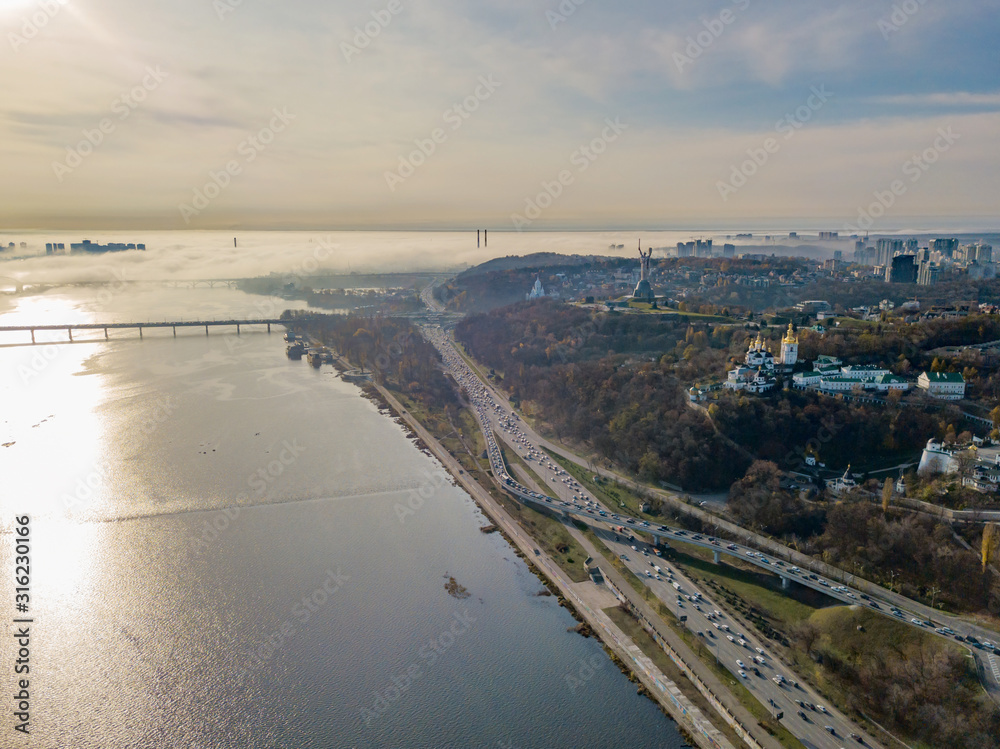 Aerial drone view. View of the Dnieper River in Kiev in the morning fog.