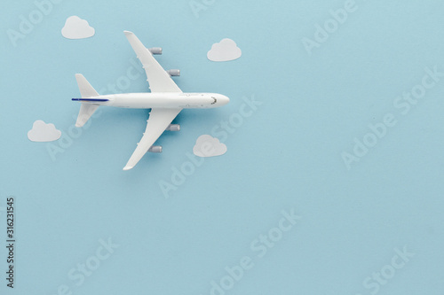 White top view Airplane . Airplane clouds blue cloud sky background with copy space for your text. Flat lay.