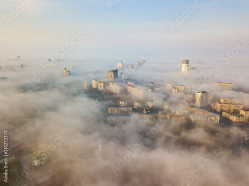 Aerial drone view. Kiev city in the autumn fog.