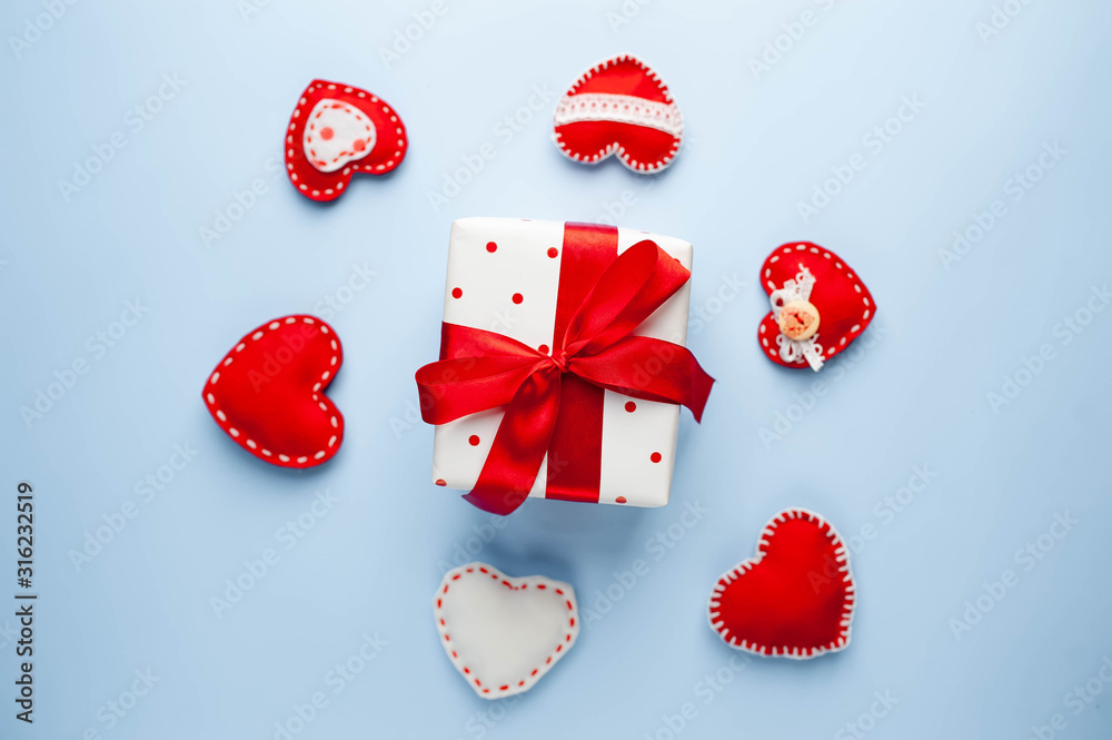 Valentine's day background. Gifts, different  hearts on a blue background. Valentine's day concept. Flat lay, top view, copy space.