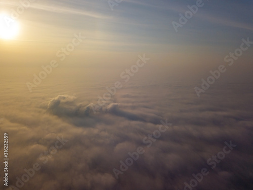 Aerial drone flight above clouds © Sergey