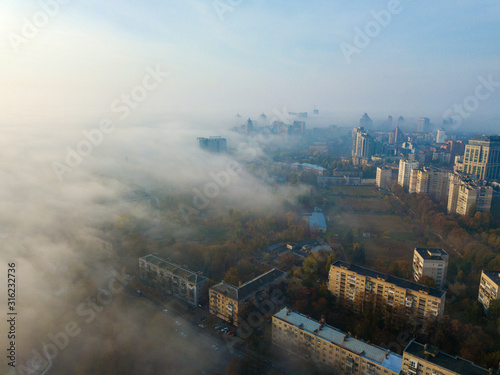 Aerial drone view. Kiev in the dense morning fog. © Sergey