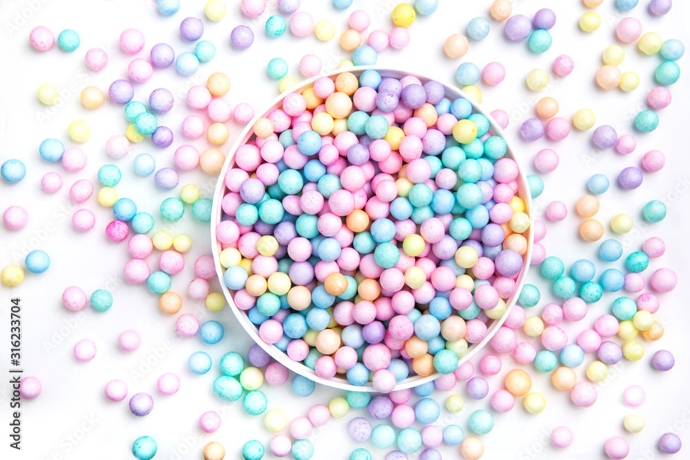 Small round candies on a white background. refreshments, vitamins.