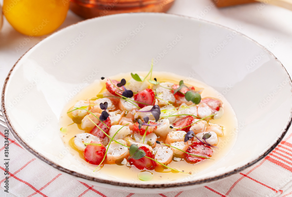 Delicious shrimp ceviche with strawberries, spices and lemon.