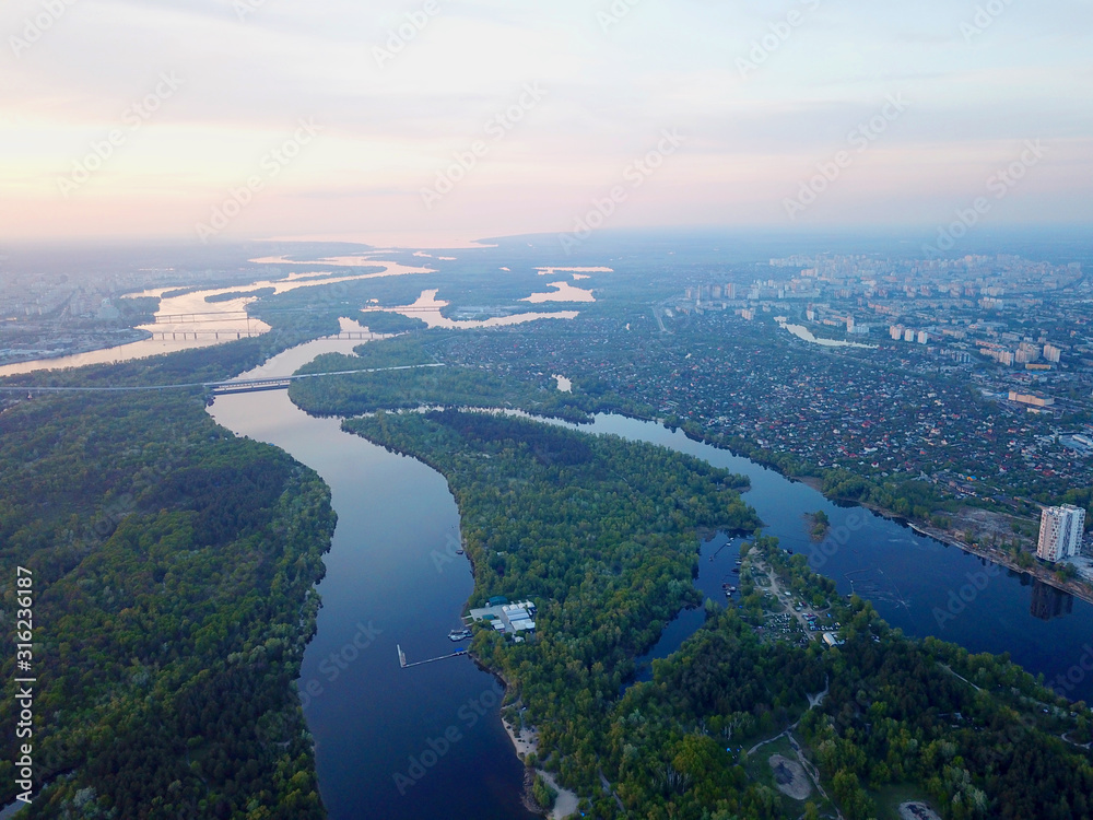 Aerial high drone view. Dnieper river in Kiev at sunset.
