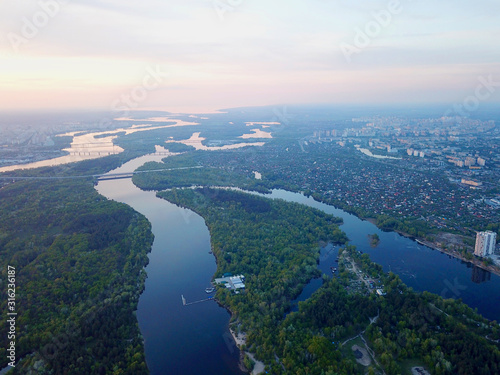Aerial high drone view. Dnieper river in Kiev at sunset.