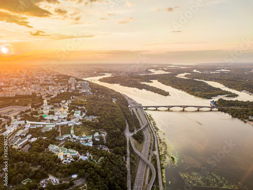 Aeiral drone view. The right bank of Kiev and the Dnieper river at sunset. photo