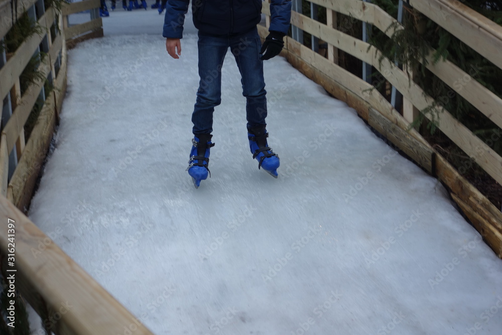 Low section of a man ice skating