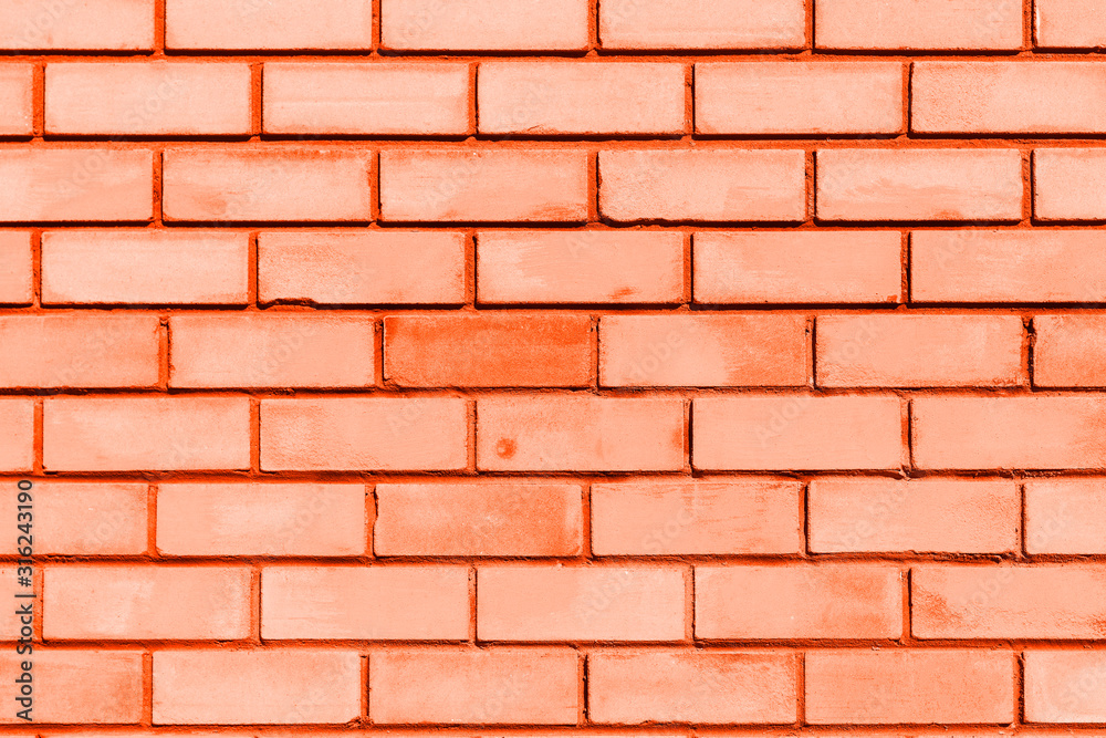  brick wall as a template for design. Orange toned trendy concept, space for text. Textured background