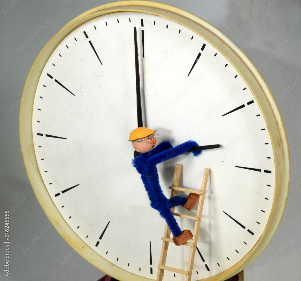 Clockman adjusting a clock to or back from Daylight Saving Time (DST
