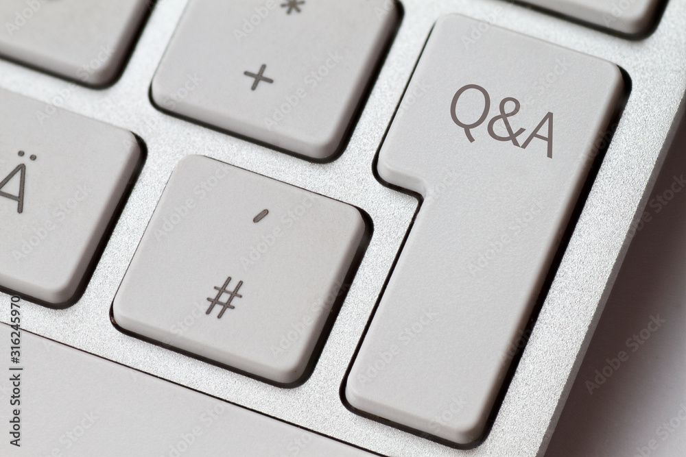 Q&A as an abbreviation on an aluminum keyboard from a computer. Q&A as an abbreviation on an aluminum keyboard from a computer.