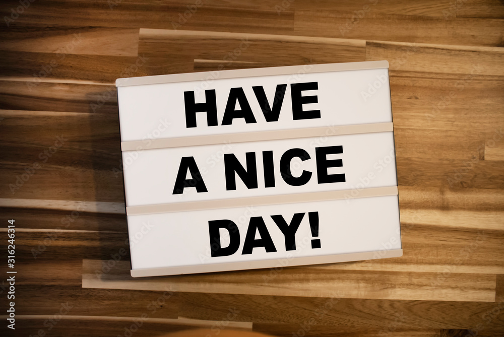 Lightbox or light box with message Have a nice day on a wooden table Lightbox or light box with message Have a nice day on a wooden table