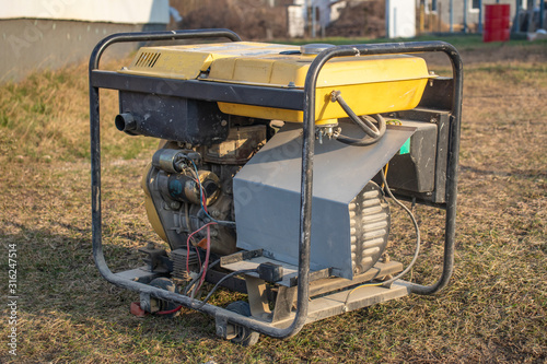 close-up. Street lighting. A gasoline-powered generator that produces current. Backup or emergency power source. The generator is not new photo