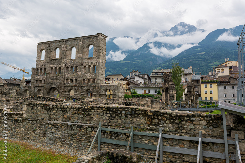 Ancient ruins of old roman amphiteatre built in Aosta.