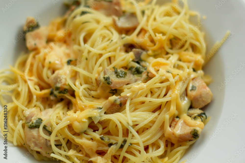 Cooked chicken breast with vegetables and mushrooms in a creamy sauce with pasta Cooked chicken breast with vegetables and mushrooms in a creamy sauce with pasta