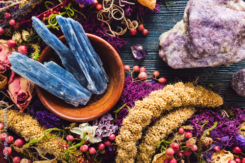 Obraz na płótnie Teak Bowl of Blue Kyanite with Lepidolite, Amethyst and Dried Spring Flowers and