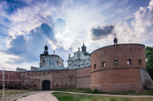Carmelite monastery walls and dramatic sky in Berdychev; Zhytomyr oblast, Ukraine