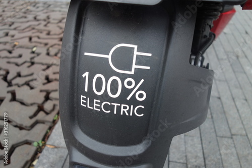 Symbol of 100% electric scooter photo