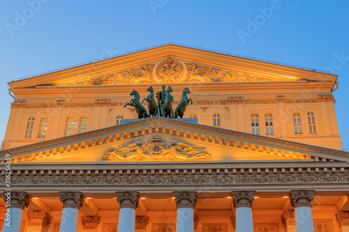 Bolshoi Theatre (Big Theatre) is historic theatre in Moscow, Russia, originally designed by architect Joseph Bove, which holds ballet and opera performances. Moscow. Facade in evening light