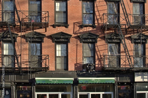 Downtown Manhattan Tenement Buildings with New Trendy Café Shop Developments Gentrification
