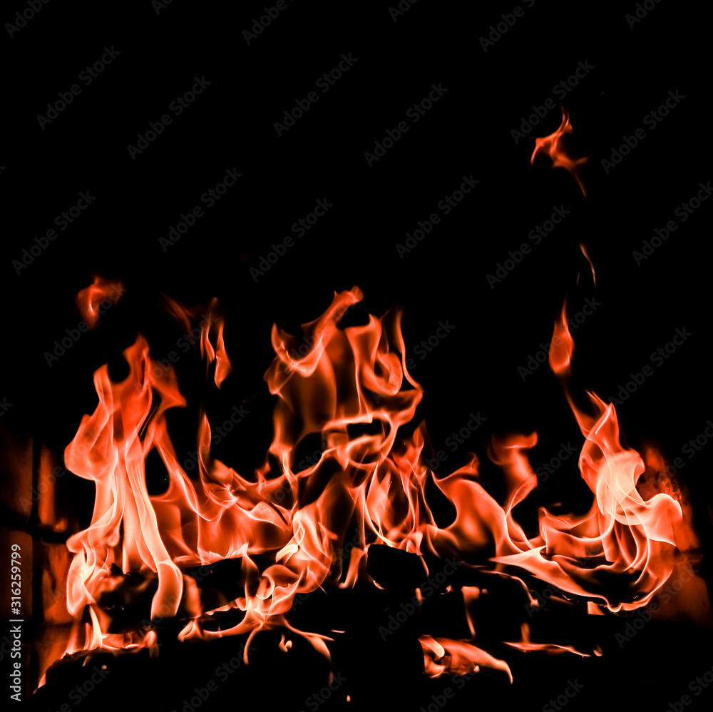 Flames of fire on a black background. The mystery of fire. Flames of fire on a black background. The mystery of fire.