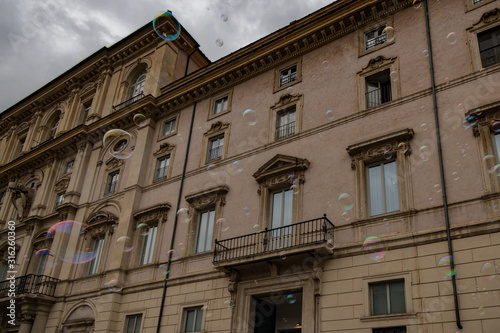 Soap bubbles with old building in background © Martina