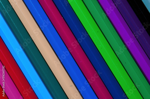 multi-colored pencils laid out to each other.