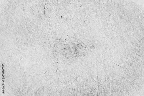 Grunge scratched texture, black and white background.