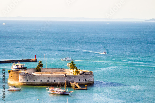  São Marcelo Fort in Salvador in Bahia Brazil with boats under the sea