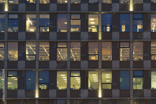 Wallpaper Mural Photography of the modern offices building interior in winter day. View of staff through the windows. Buildings of glass and metal. Modern city lifestyle. Torontodigital.ca