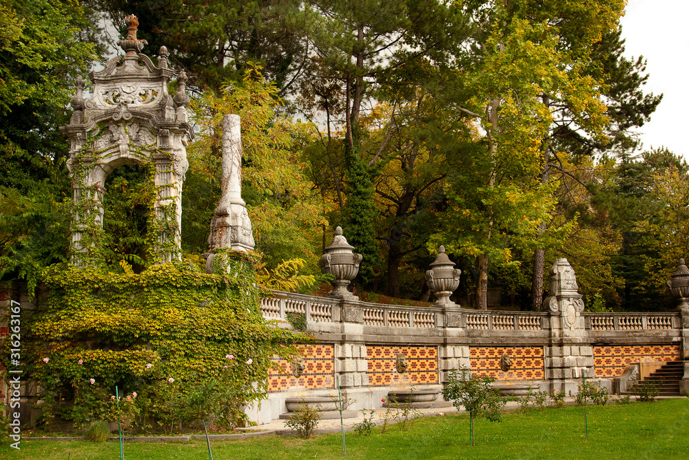Autumn folliage and baboque fence in a back yard Massandra Palace in Yalta, Crimea