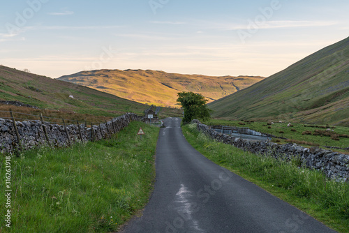 Rural road in the Yorkshire Dales between Gawthrop and Barbon, Cumbria, England, UK photo