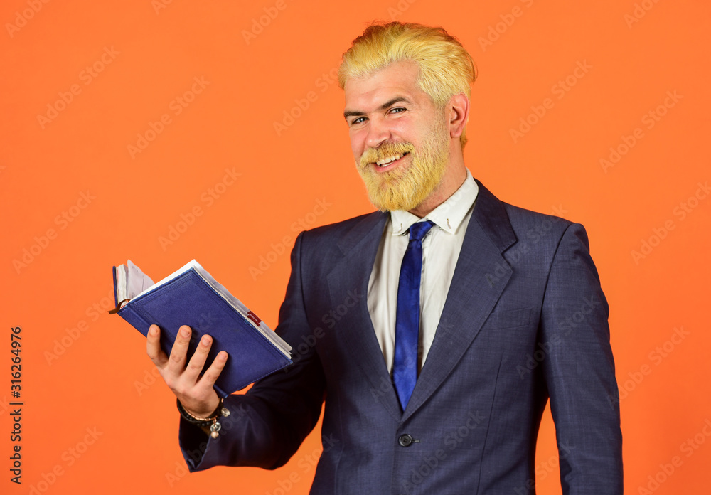 mature man dyed beard and hair. reading book. check his notes. daily schedule. male professional teacher. after barbershop. business school education. happy businessman hold notebook mature man dyed beard and hair. reading book. check his notes. daily schedule. male professional teacher. after barbershop. business school education. happy businessman hold notebook