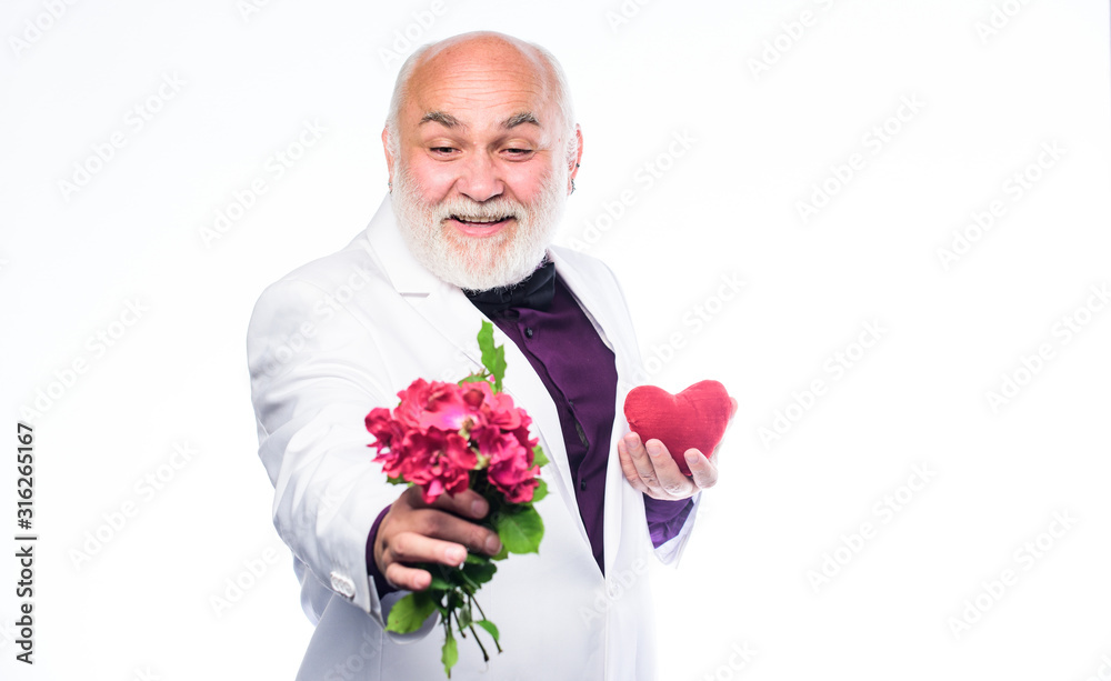 This is for you. Gentleman concept. True gentleman. Handsome bearded man wear tuxedo. Romance and dating. Dating services for elderly people. Senior gentleman romantic. Man hold heart symbol of love This is for you. Gentleman concept. True gentleman. Handsome bearded man wear tuxedo. Romance and dating. Dating services for elderly people. Senior gentleman romantic. Man hold heart symbol of love