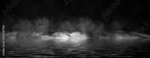 Panoramic view mystic smoke on the floor. Paranormal fog isolated on black background.