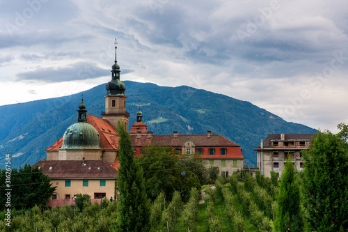 Old monastery with apple trees garden. Tirol, South Tyrol. photo