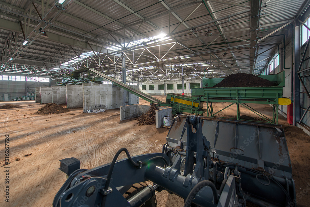 Fototapeta premium loading of peat raw materials, at the processing plant