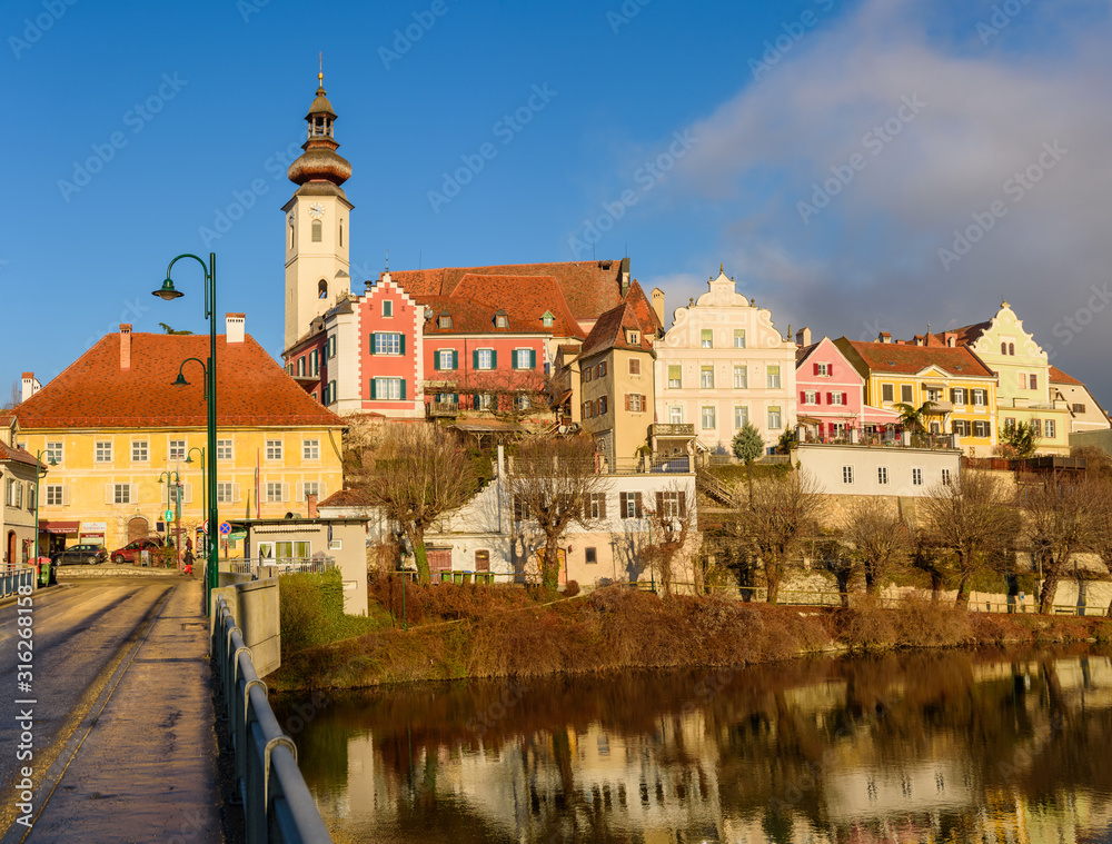 Obraz premium Frohnleiten church tovwer above Mur river in Styria,Austria. Famous travel destination.