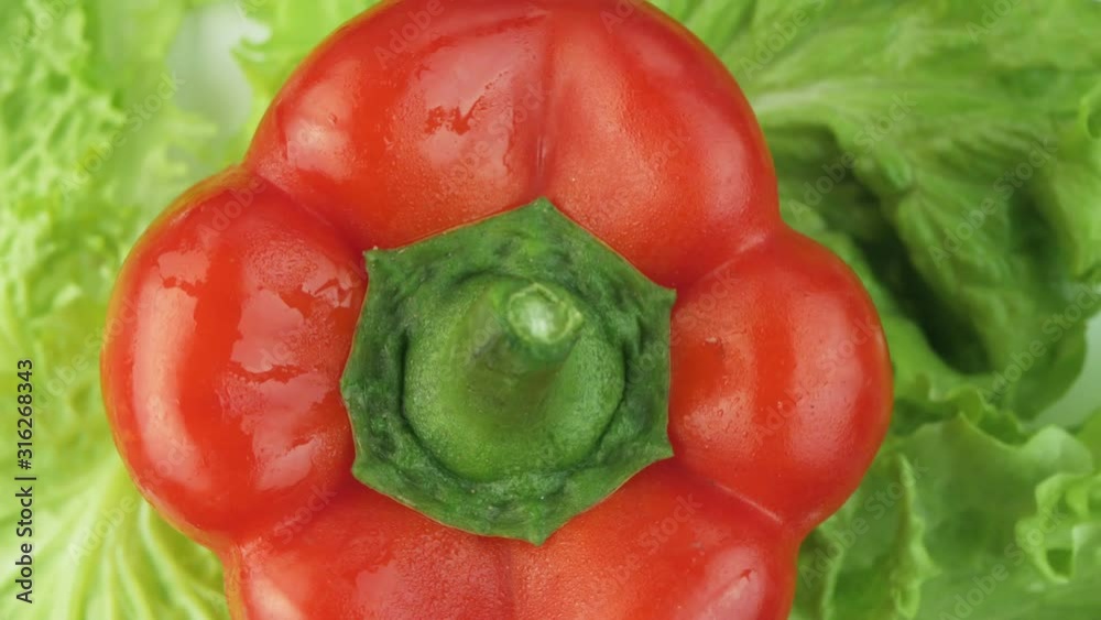Lettuce and sweet bell pepper on a rotating background Lettuce and sweet bell pepper on a rotating background