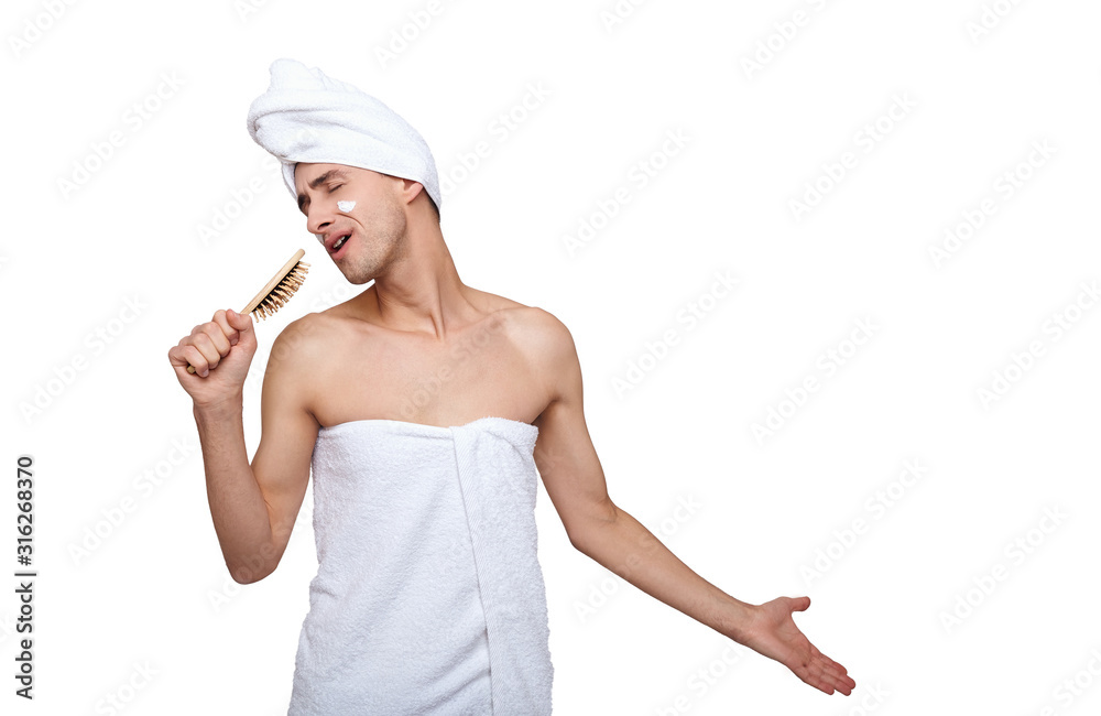 Singing a thin guy after a shower, isolate on a white background. Singing a thin guy after a shower, isolate on a white background.