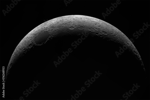 Foto Crescent of a young moon with a large increase