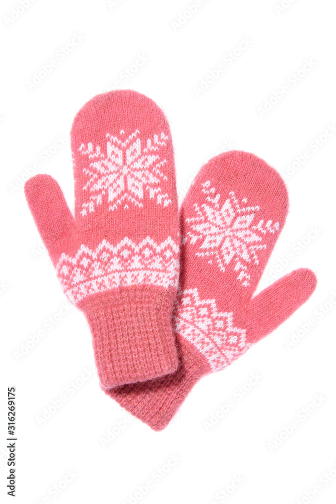 Warm woolen knitted mittens isolated on white background. Pink knitted mittens with pattern Warm woolen knitted mittens isolated on white background. Pink knitted mittens with pattern