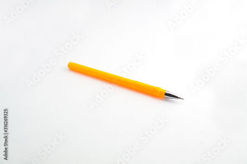 yellow handle plastic pen on a white background
