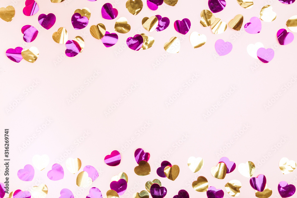 Colorful heart confetti on a background.