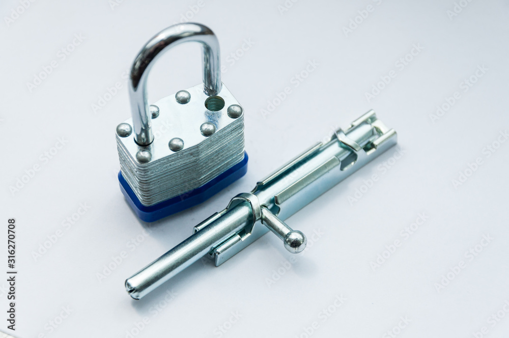 Close-up small padlock and latch for a door Close-up small padlock and latch for a door
